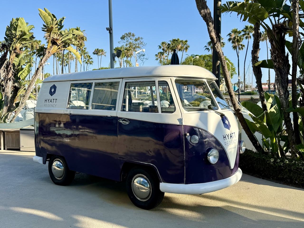 shortened VW bus parked as decoration at the hotel pool